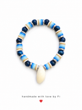 Navy blue and striped clay heishi disc bracelet with cowrie shell drop and rhinestone spacers handmade by Fi