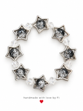 Handmade silver-tone star bracelet with smoky crystal-look beads and clear faceted accents