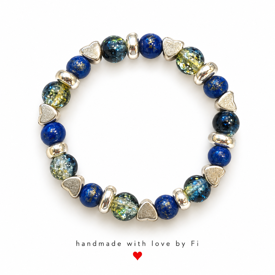 Deep blue and blue-green beaded bracelet with silver-tone heart accents