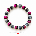 Magenta and slate-grey round beaded bracelet with white pearl-look spacers