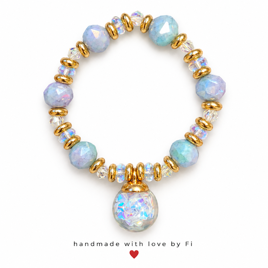 Handmade bracelet with pastel blue and lavender faceted beads, iridescent accents and a large round shimmer-effect pendant