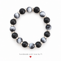 Black textured and shimmering slate-grey beaded bracelet with twisted silver-tone spacers