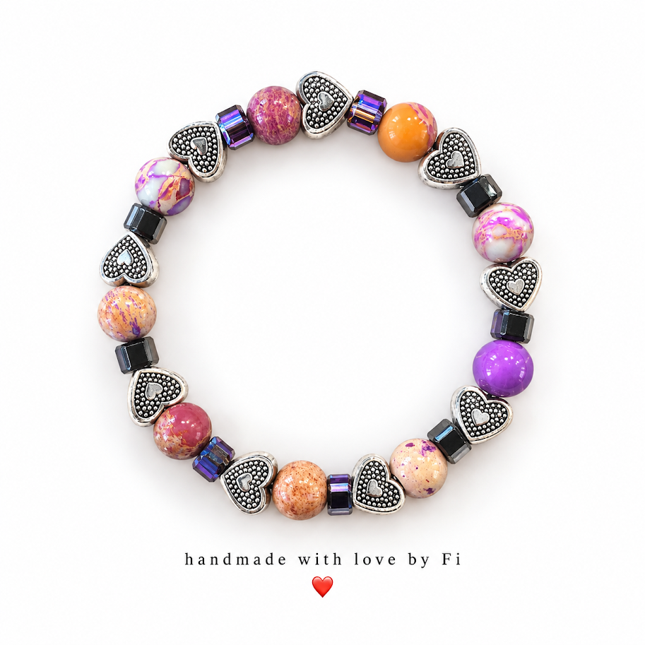 Colourful marbled beaded bracelet with silver-tone heart beads and dark iridescent cube accents