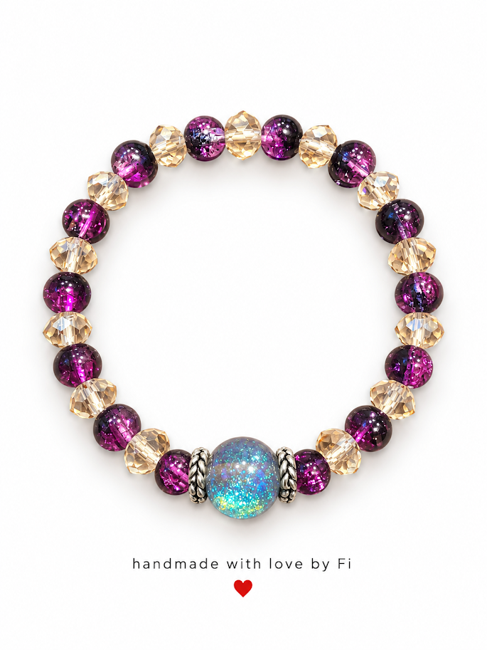 Handmade bracelet with deep purple beads, champagne-gold crystals and a glittering galaxy centre bead