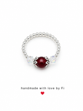 Deep red garnet and crystal stretch ring on silver ball bead band handmade by Fi