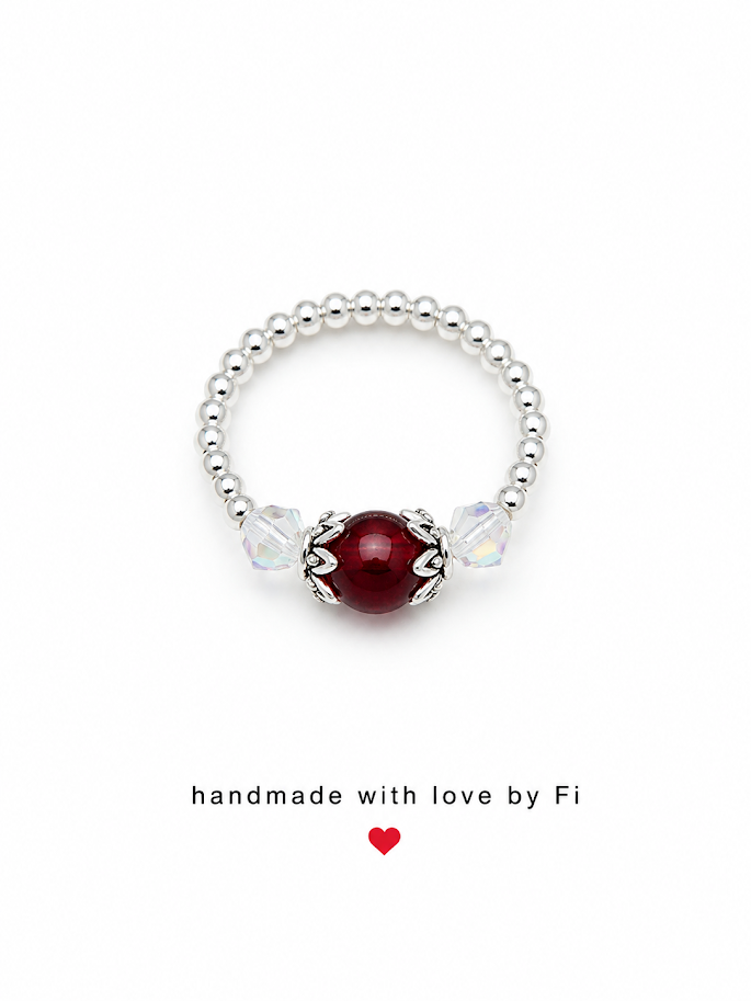 Deep red garnet and crystal stretch ring on silver ball bead band handmade by Fi