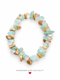 Handmade aqua blue and clear gemstone chip bracelet with textured gold-tone accents