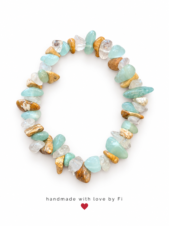 Handmade aqua blue and clear gemstone chip bracelet with textured gold-tone accents