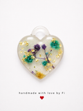 Purple and teal botanical resin heart pendant with yellow flower gold leaf and silver glitter handmade by Fi