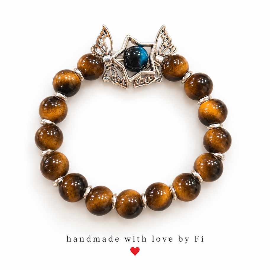 Golden-brown beaded bracelet with silver-tone butterfly details and a star framing a blue-black bead