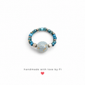 Teal and galaxy bead stretch ring handmade by Fi