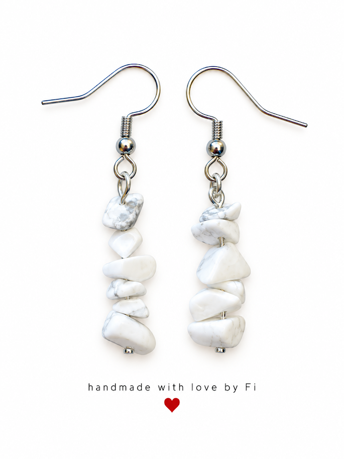 White chip-style drop earrings with subtle grey markings and silver-tone fishhook wires