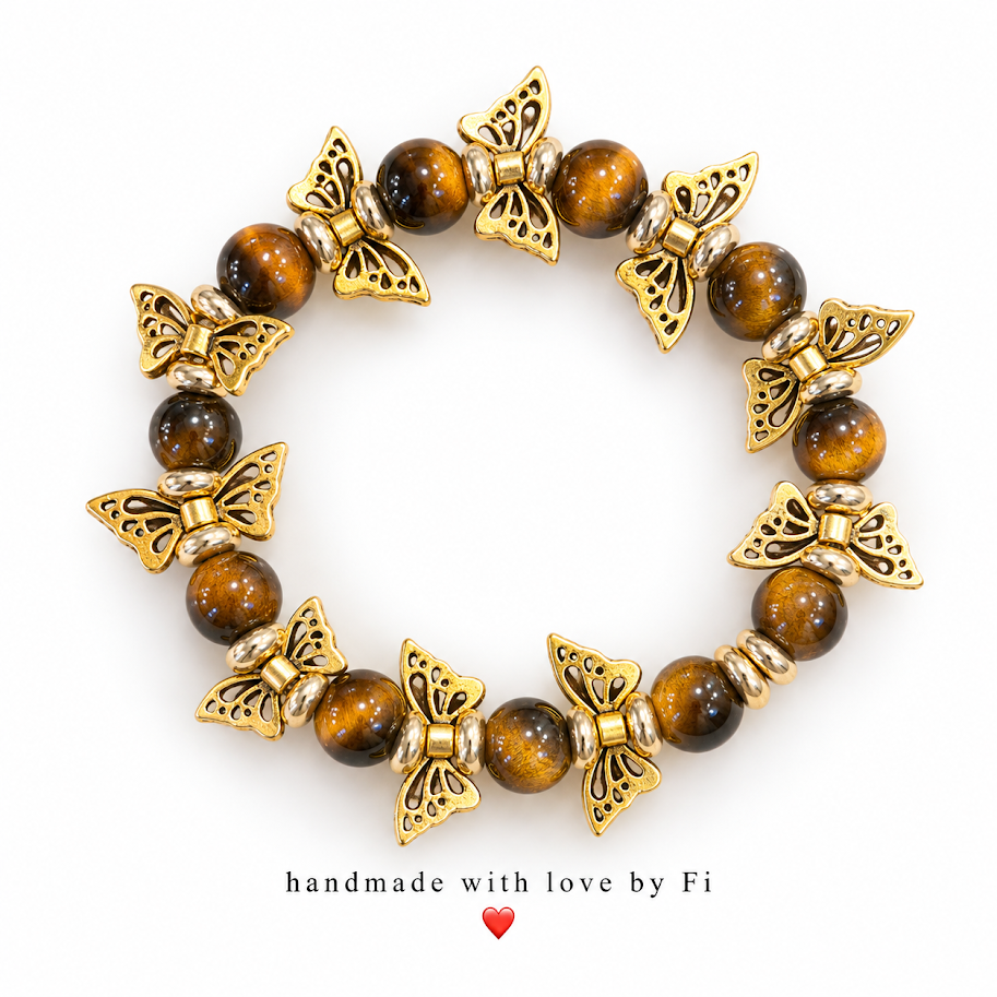 Glossy brown round beads with gold-tone butterfly accents and silver-tone spacers