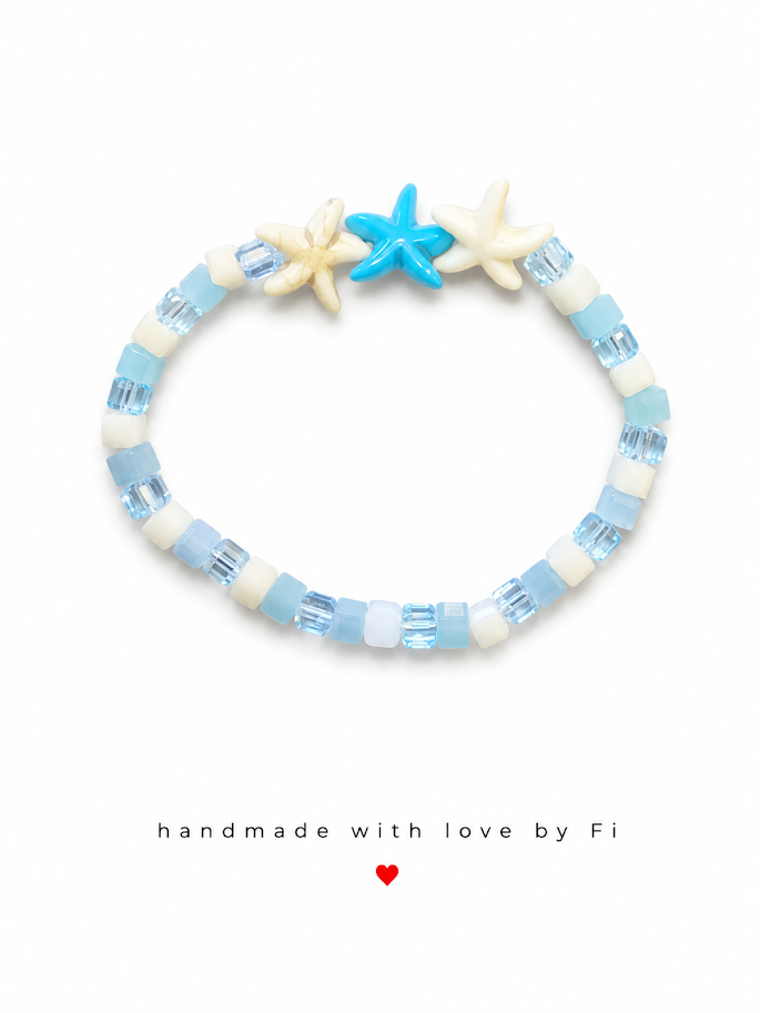 Pale blue and white cube bead bracelet with triple turquoise and cream ceramic starfish charm handmade by Fi