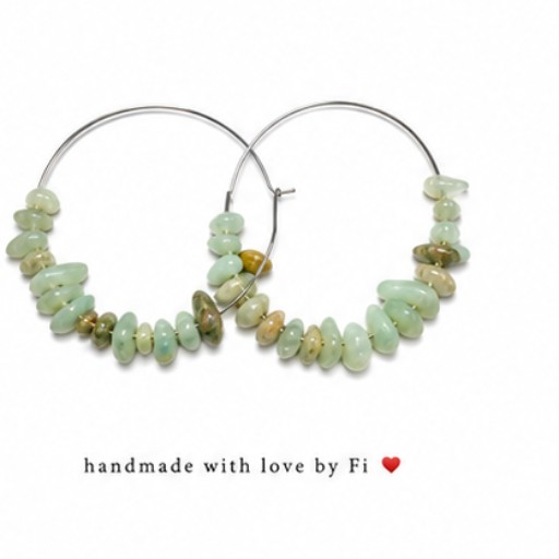 Silver-tone hoop earrings decorated with pale green chip-style beads and gold-tone accents