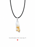 Raw clear quartz crystal point pendant necklace on black wax cord with golden phantom inclusions and silver bail handmade by Fi