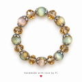 Pastel green and blush bracelet with champagne faceted beads and silver-tone leaf accents