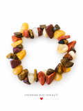 Chip bead bracelet in golden yellow, rusty red, brown and creamy white with striped and mottled details