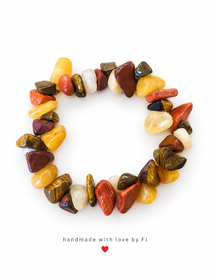 Chip bead bracelet in golden yellow, rusty red, brown and creamy white with striped and mottled details