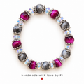 Magenta and textured charcoal grey bracelet with iridescent beads and ornate silver-tone bead caps