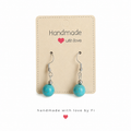 Turquoise drop earrings on silver-tone hooks handmade by Fi