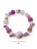 Purple and lilac beaded bracelet with chip accents, clear faceted beads and a large patterned lilac centrepiece