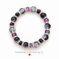 Purple, black and clear crackle-effect beaded bracelet with silver-tone spacers