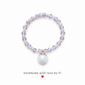 Grey lilac AB crystal bracelet with holographic iridescent confetti globe charm and gold bail handmade by Fi