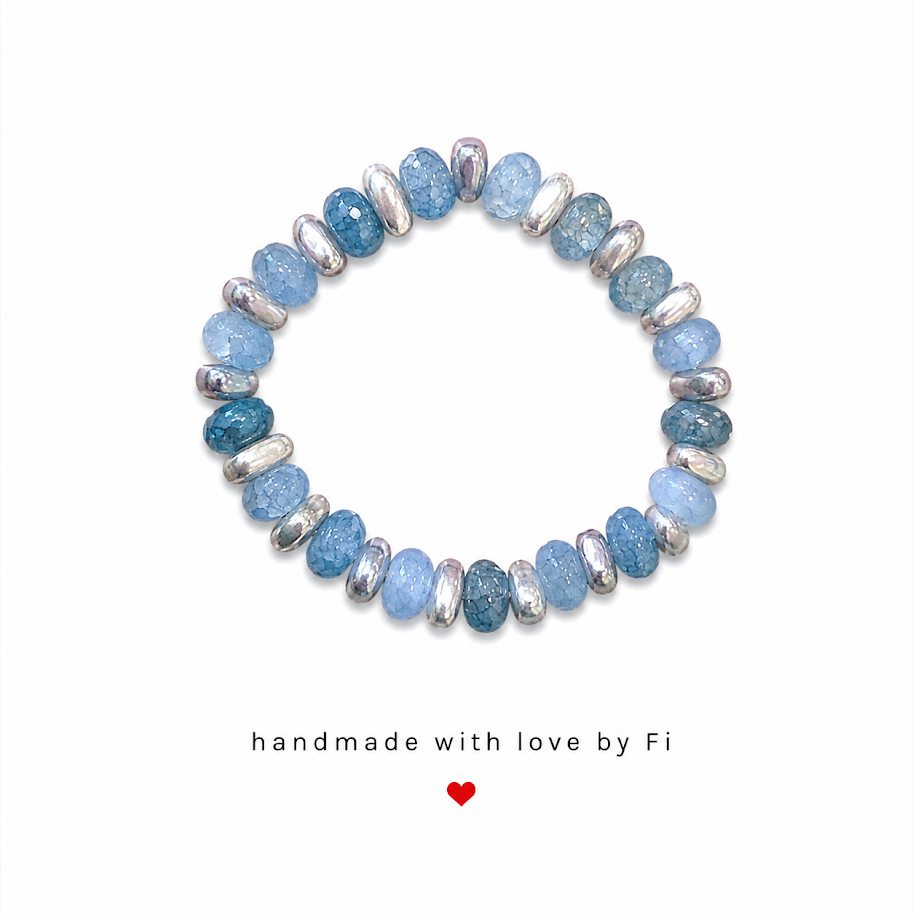 Powder blue and teal crackle rondelle bracelet with silver oval spacers handmade by Fi