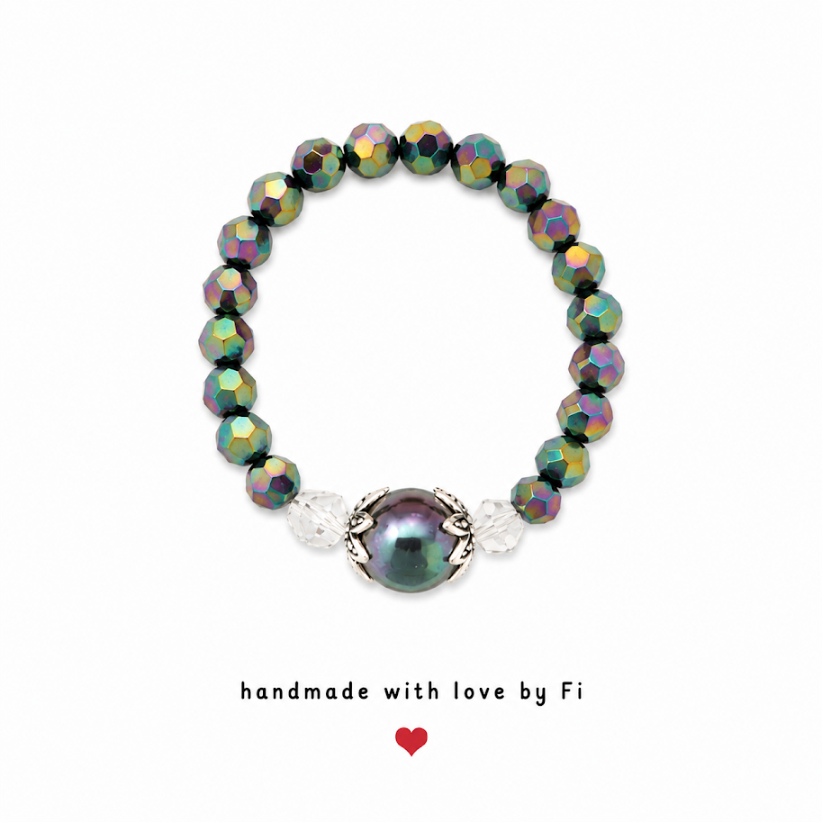 Peacock pearl and iridescent green AB crystal stretch ring with ornate silver bead caps handmade by Fi